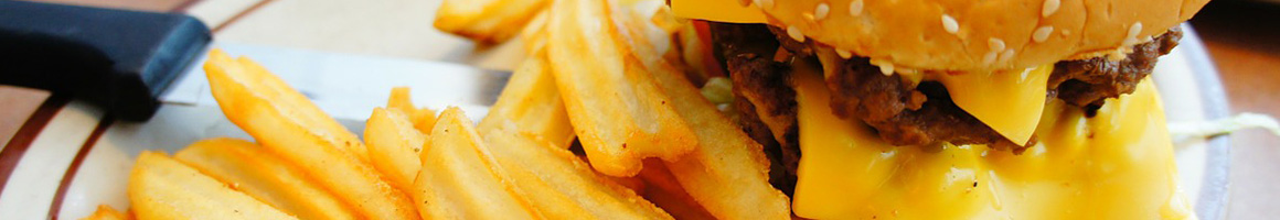 Eating Burger Fast Food at Burger Basket restaurant in Monrovia, CA.